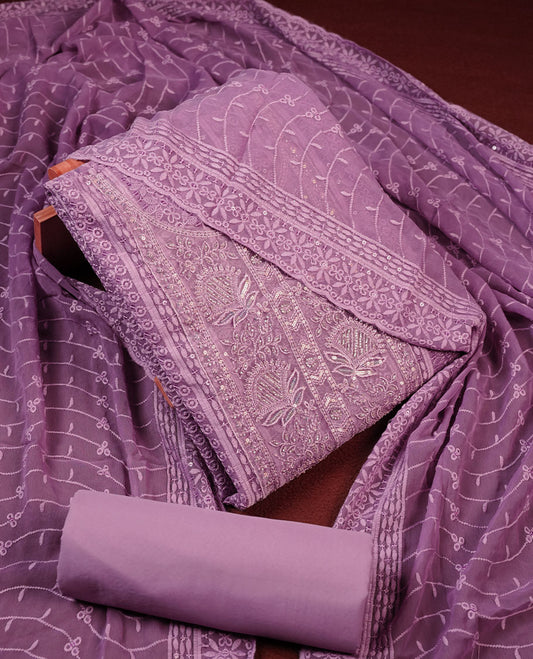 Lavender colour churidhar Material featuring Intricate Thread Embroidery with Mirror and Cut Beads Work on the Front Panel, paired with an All Over Embroidered Net Dupatta and Matching Bottom