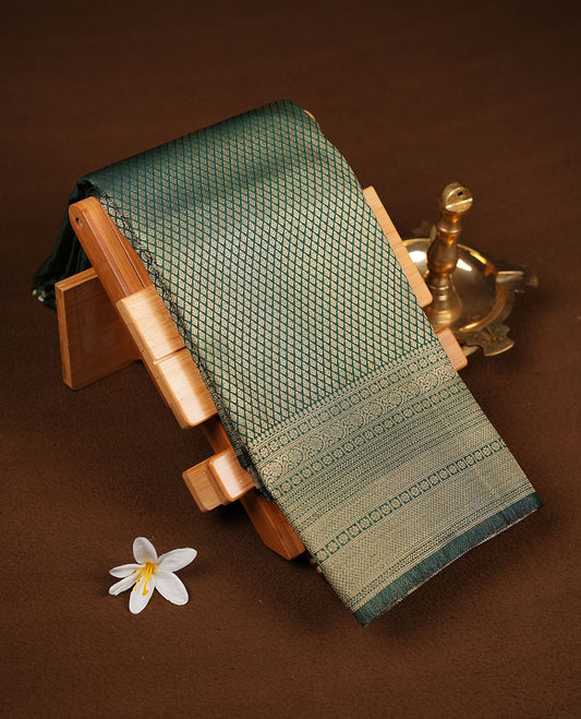 Emerald Green semi soft silk brocade saree with fine geometric woven body and a rich traditional border, finished with a matching blouse.