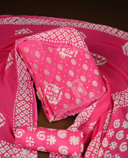 Pink colour churidar material featuring elegant gold butta work on the front panel, paired with a printed dupatta and matching bottom.