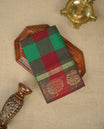 Maroon & green colour chettinad cotton saree featuring check pattern on body, complemented by Self Colour with gold zari border, comes with matching blouse piece.