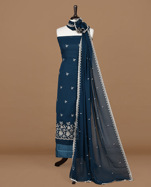 Teal colour churidhar material featuring gold thread floral pattern on body, paired with matching bottom & dupatta.