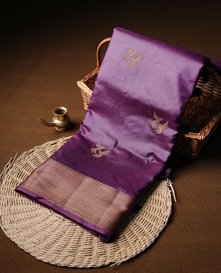 Purple colour semi banaras tussar silk saree highlighting gold zari bird motifs on body, complemented by self colour with antique zari border, paired with matching blouse piece.