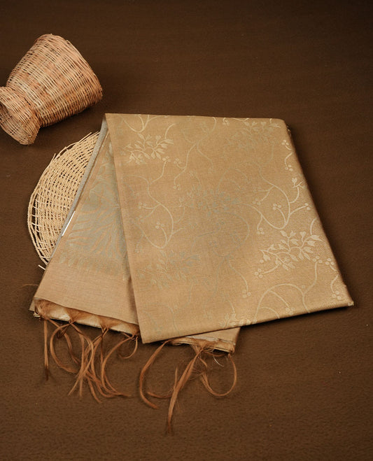 Gold colour semi tussar silk saree, featuring an intricate gold zari floral kodi pattern on the body and pallu, comes with matching blouse.