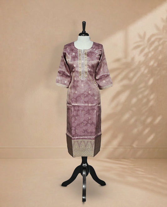 Lavender colour Kurti featuring an intricate floral pattern, a  U-shaped neckline adorned with detailed Stone & thread work, and 3/4 sleeves Design