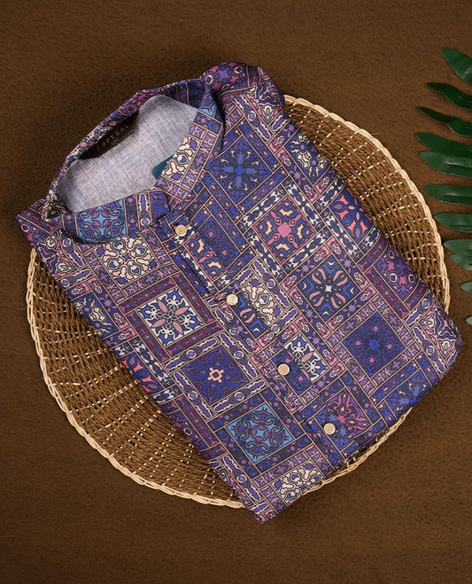 Navy blue men's kurta with intricate multicolour ethnic motifs, featuring a patchwork-inspired print, Mandarin collar, buttoned neckline, and full sleeves for a refined traditional ensemble.