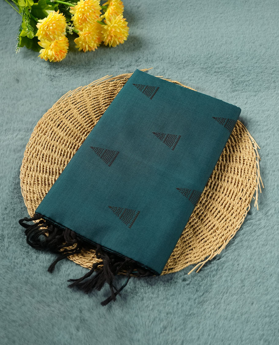 Dark Teal Green colour poly cotton saree with black temple motifs on the body, paired with a matching with black woven traditional border, and a coordinated all‑over geometric printed blouse piece.