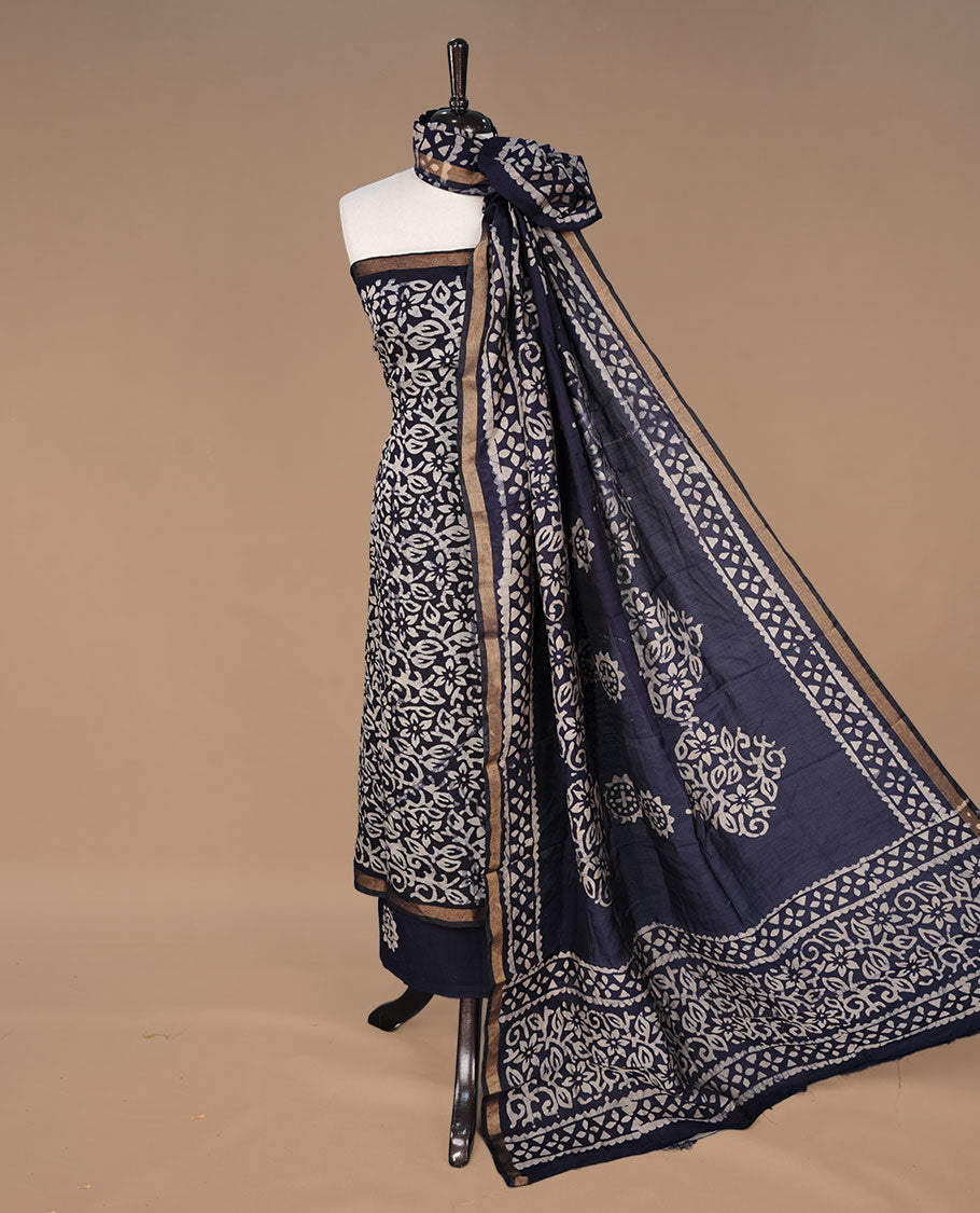Dark blue colour churidhar material featuring cream colour floral kodi print on body, paired with matching bottom and Dupatta.