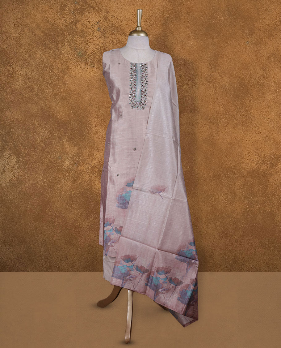 Cream tan colour churidar set featuring elegant white thread embroidery on the neckline, sleeves, and scattered motifs across the body, Paired with a matching embroidered dupatta