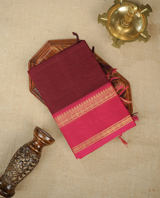 Redish brown colour chettinad cotton saree featuring gold zari motifs on body, Contrast magenta colour with Gold zari border, comes with matching blouse piece.