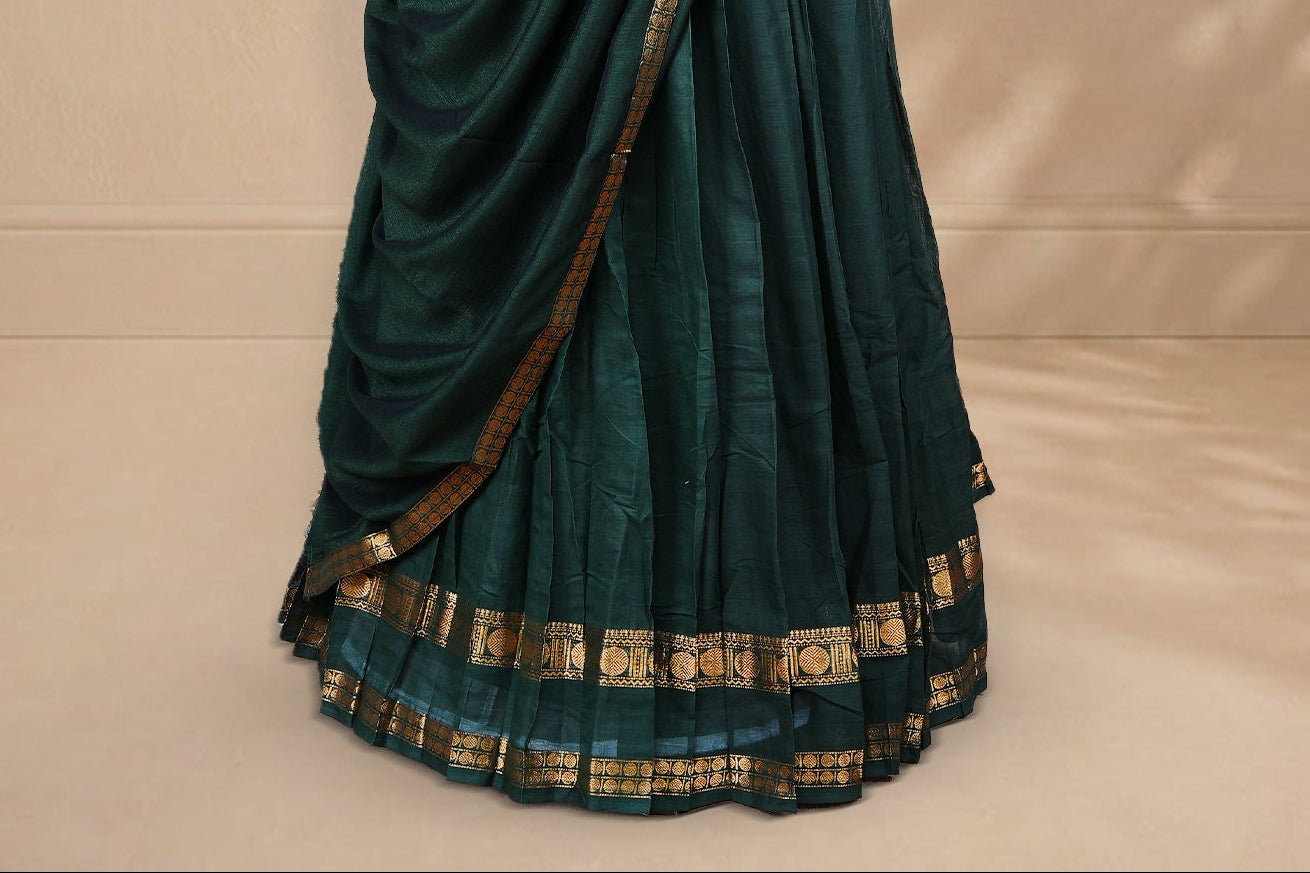 Bottle green colour Half saree featuring Plain skirt with Zari border on Self colour border, Unstitched Blouse and matching dupatta.