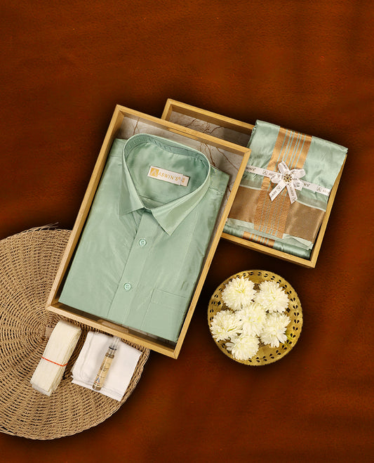 Pista green colour Aswin's wedding set featuring a shiny silk finish full sleeve shirt, paired with a matching pista green dhoti adorned with a rich golden zari border, perfect for weddings and festive occasions.