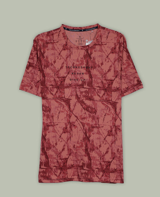 Light coral colour T shirt featuring a bold abstract tie dye pattern in darker red tones, designed with a classic round neck and short sleeves for a relaxed and stylish everyday look.