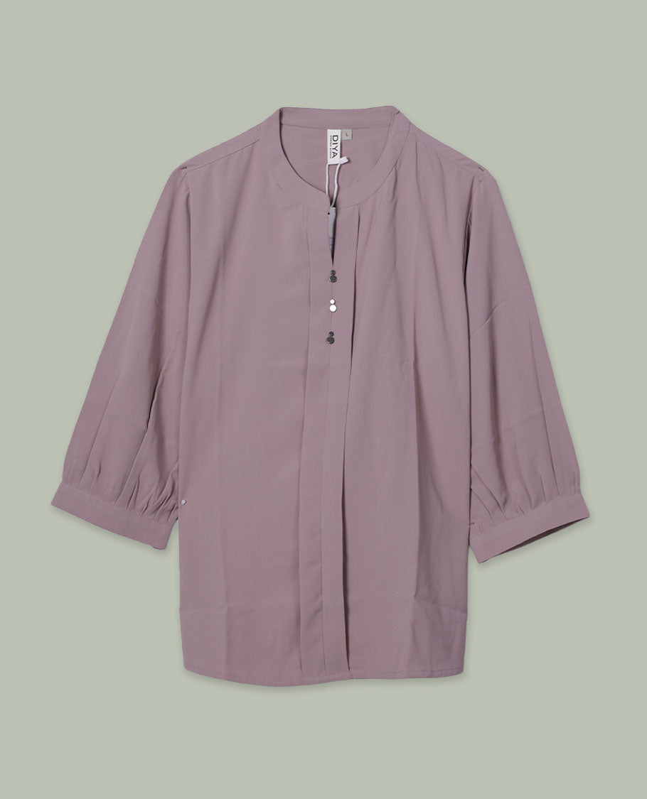Mauve colour solid top featuring a band collar with a half button placket, soft pleat detailing at the front, and three-quarter sleeves.