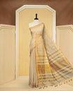 Light Gold colour Semi Tissue Silk saree featuring Elegant plain body, Enhanced with Gold tissue Border & Striped Pallu & beautiful Tassels for Elegant Prefect Look.