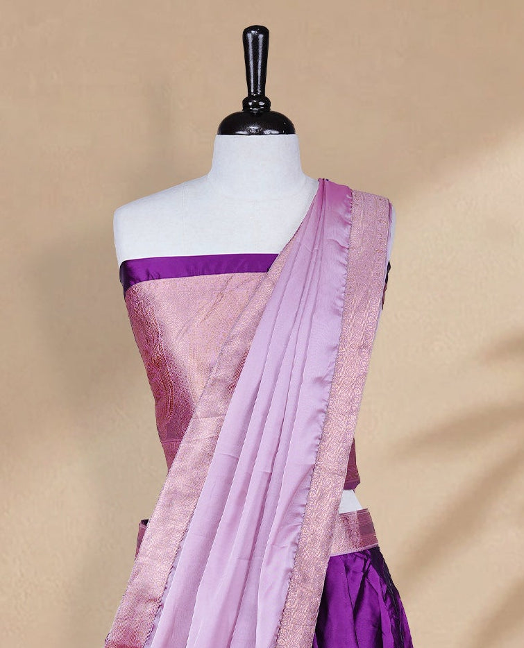 Purple colour Half saree featuring Plain skirt with Zari border on contrast Pink colour border, Unstitched Blouse and matching dupatta.