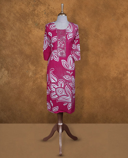 Pink colour kurti with white floral prints, knee length design, styled with a round neckline and a sleeve .
