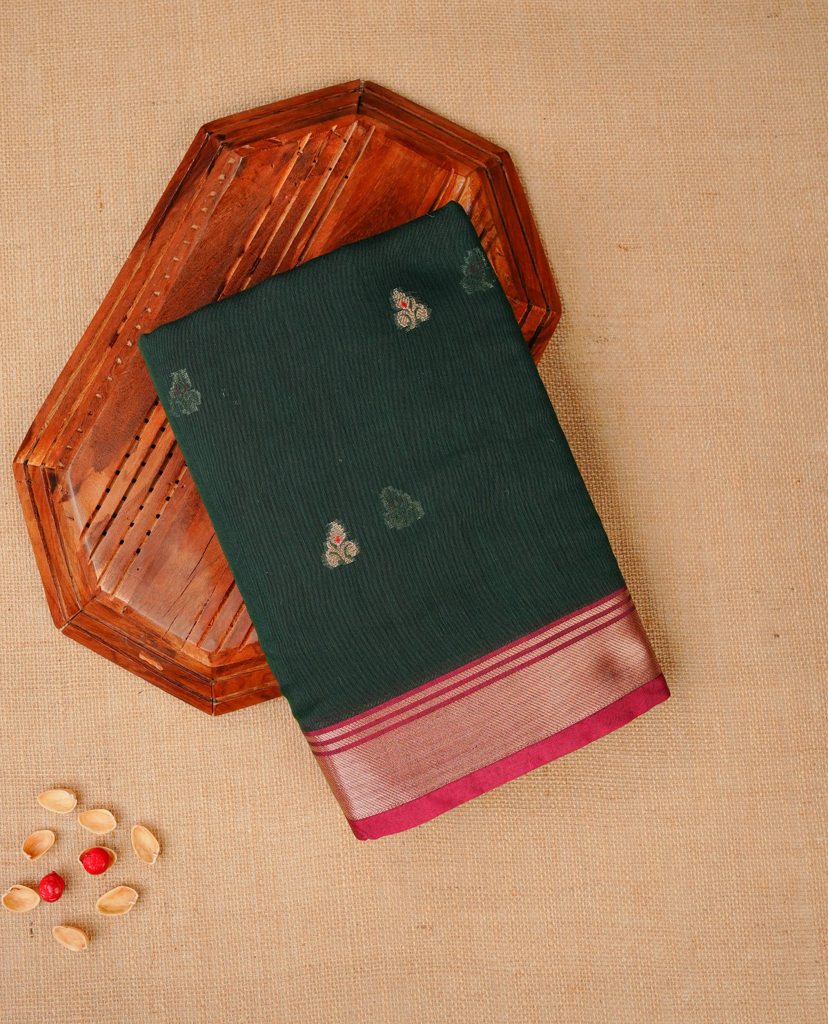 Dark green colour Maheshwari cotton saree, gold zari floral motifs on body, complement pink colour gold zari border comes with matching blouse.