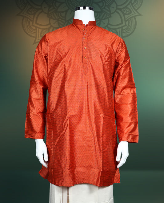 Rust orange men’s kurta crafted in a rich textured fabric, featuring a mandarin collar, full sleeves, side slits, and a buttoned placket, ideal for traditional, festive, and cultural occasions.