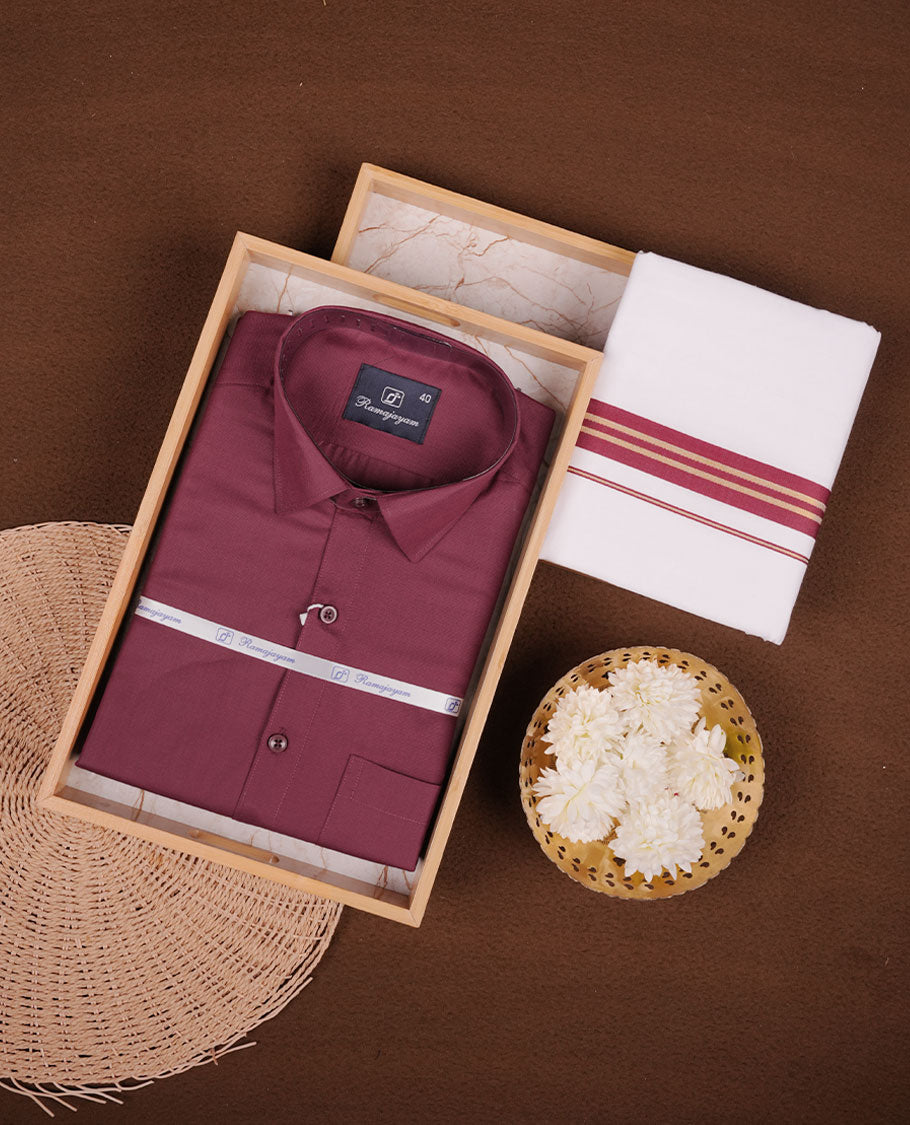 Maroon Colour shirt paired with a matching dhoti, finished with a maroon and gold border.