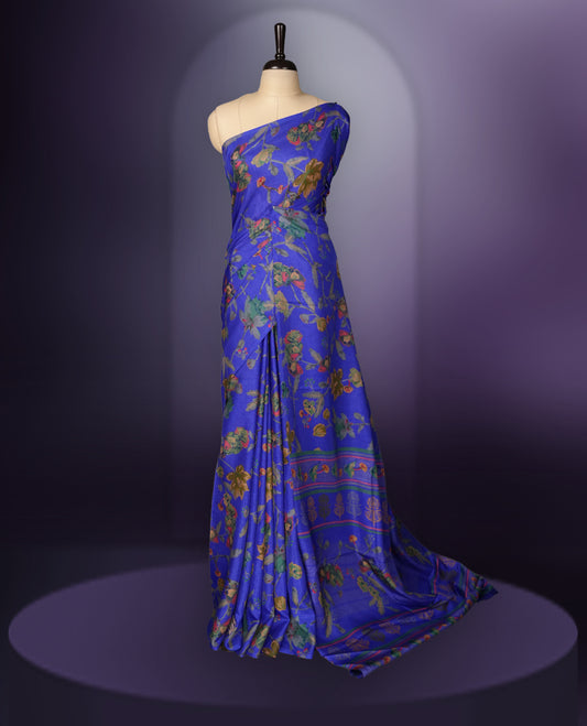 Violet blue colour saree enhanced with a vibrant blue colour floral prints on body & pallu, and  comes with a matching blouse.