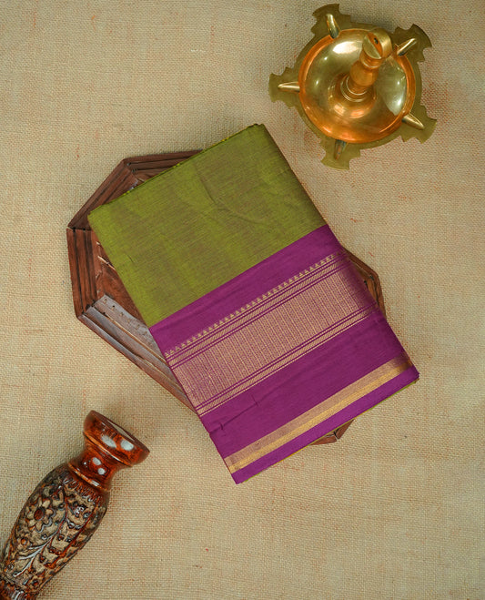 Lemon green colour chettinad cotton saree featuring elegant plain body, Contrast Magenta colour with Gold zari border, comes with matching blouse piece.