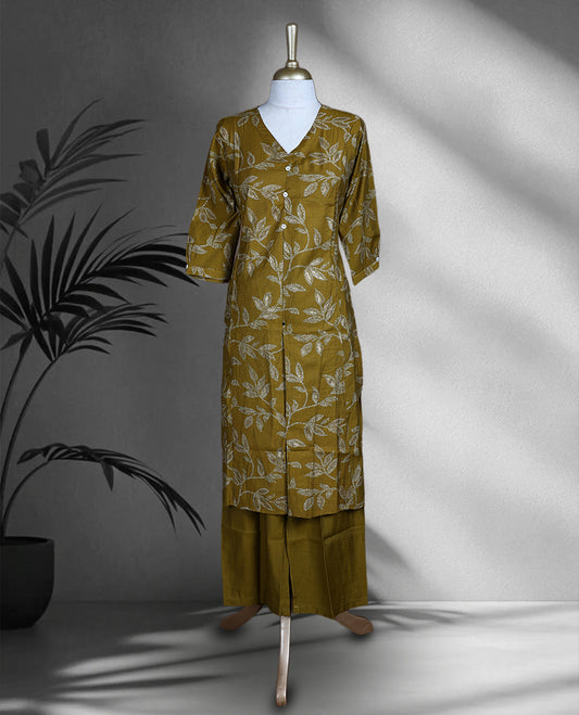 Mustard yellow colour cord set with elegant leaf motifs, featuring a V neck top with button detailing and matching straight fit pants.