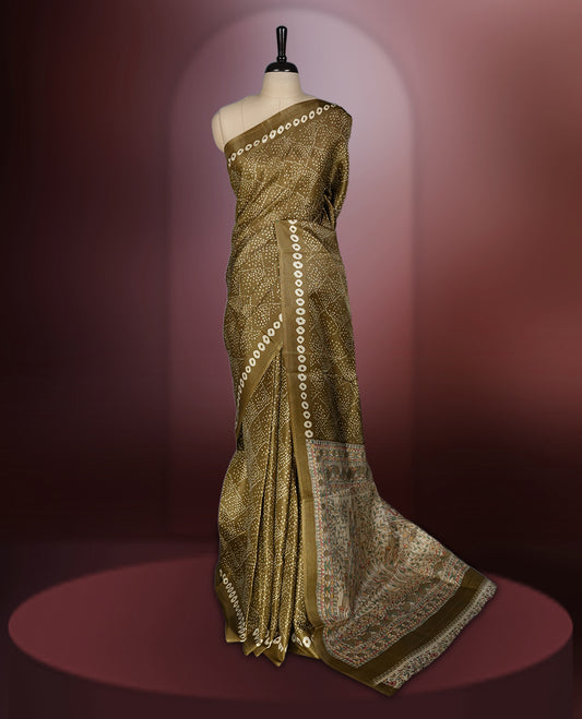 Golden brown colour saree with dotted tie dye patterns and cream circular border motifs & The pallu features exquisite Madhubani inspired designs in earthy hues,Paired with matching blouse, ideal for festive wear.