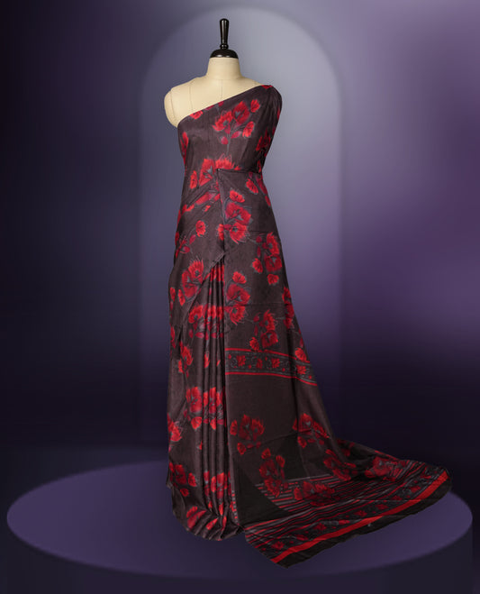 Deep brown colour saree enhanced with a vibrant red colour floral prints on body & pallu, and  comes with a matching blouse.