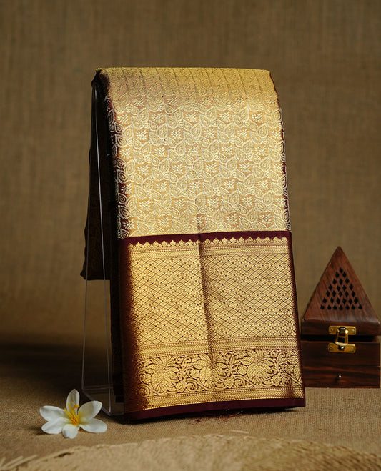 Gold & chocolate double shade colour kancheepuram tissue silk saree featuring gold zari floral kodi pattern on body, complemented by contrast maroon colour with traditional border, paired with matching blouse piece.