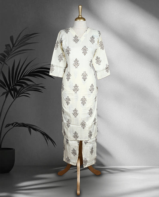Off white colour Cord set with brown and green floral block print, featuring a V neck top with a straight cut silhouette and side slits, paired with matching straight fit pants.