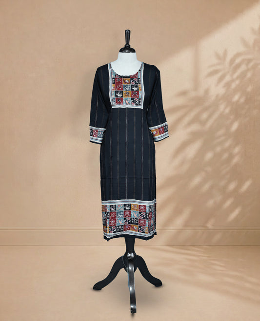 Black colored Kurti featuring vertical dotted lines across the body, a round neckline adorned with animal and floral prints and thread work, and 3/4 sleeves.