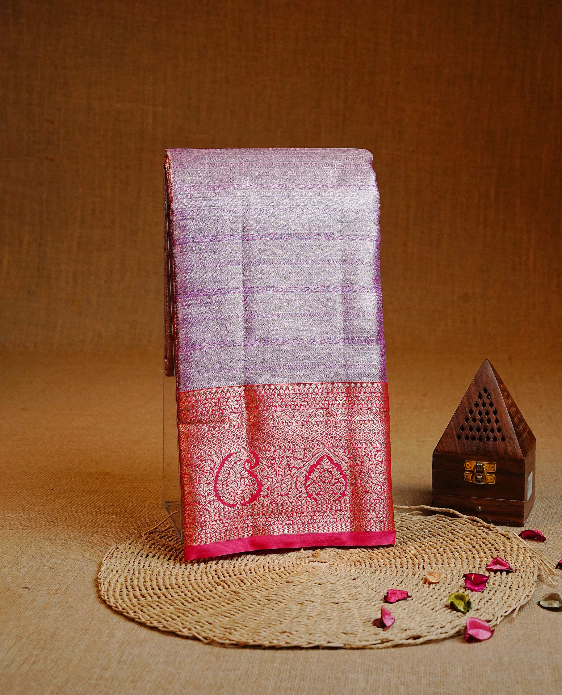 Pink & Silver colour Double shade Semi tissue silk saree featuring self color Stripes on body, Contrast Magenta colour with traditional border, paired with matching.