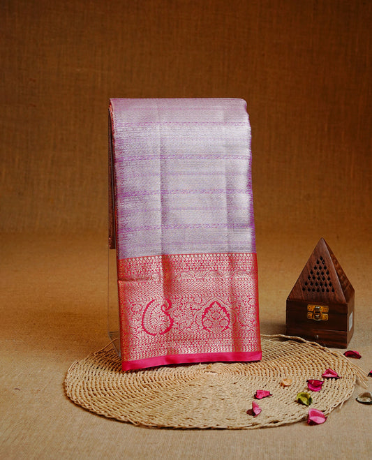 Pink & Silver colour Double shade Semi tissue silk saree featuring self color Stripes on body, Contrast Magenta colour with traditional border, paired with matching.