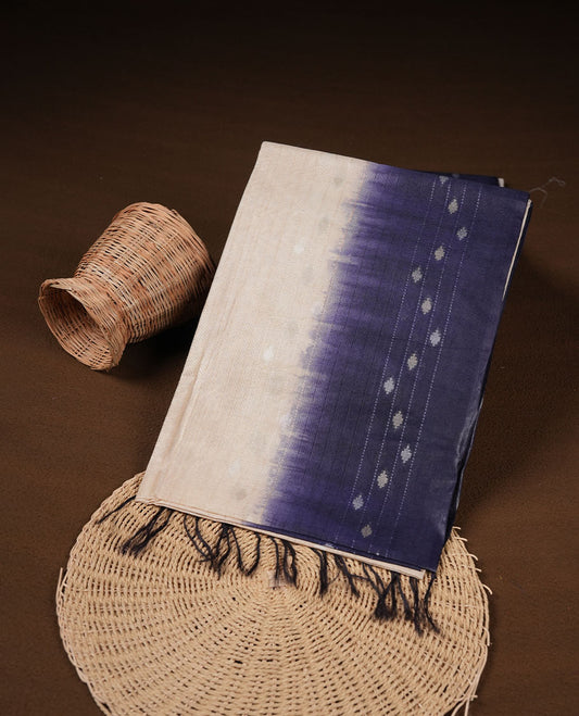 Cream & Dark blue dye pattern colour semi jute saree highlighting white stripped body, without border and paired with matching blouse.