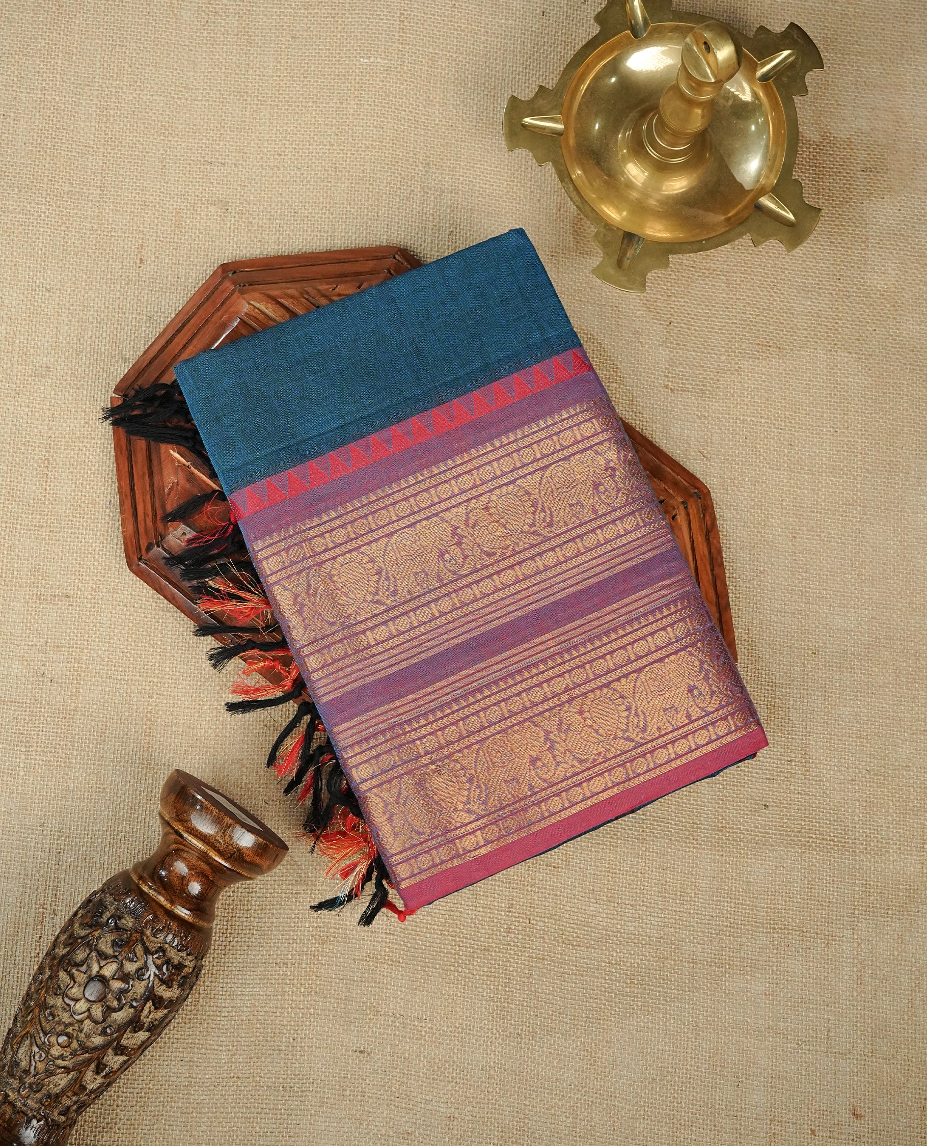 Blue colour chettinad cotton saree featuring Elegant plain body,Contrast Pink colour with Gold zari border, comes with matching blouse piece.