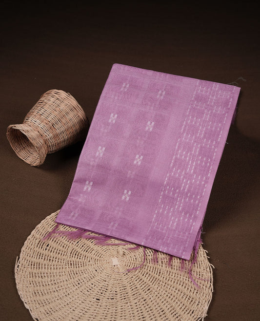 Light lavender colour semi jute saree highlighting white thread motifs on body, without border and paired with matching blouse.