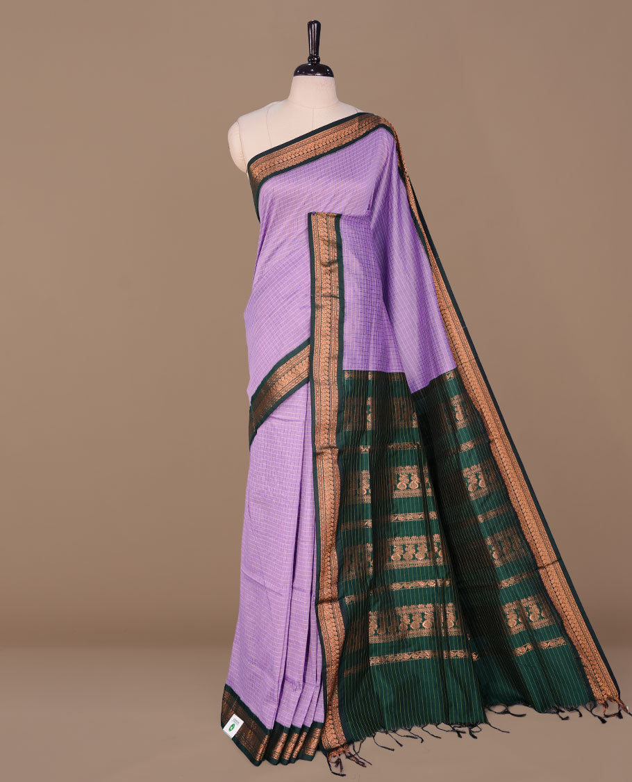 Lavender colour kalyani cotton saree featuring gold zari check pattern on body, complemented by green colour with Antique zari border, paired with matching blouse piece.