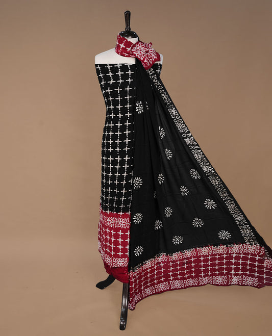 Red and Black colour churidhar material featuring cream colour floral kodi print on body, paired with matching bottom and Dupatta.