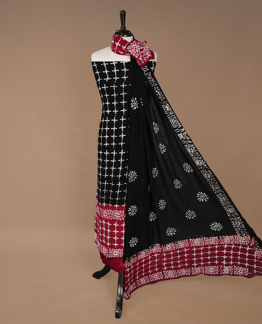 Red and Black colour churidhar material featuring cream colour floral kodi print on body, paired with matching bottom and Dupatta.