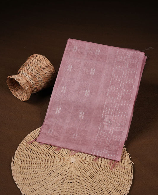 Baby pink colour semi jute saree highlighting white thread motifs on body, without border and paired with matching blouse.
