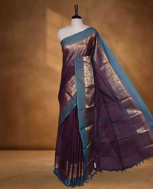Wine colour chettinad cotton saree featuring plain body, with matching traditional gold zari border paired with matching blouse.