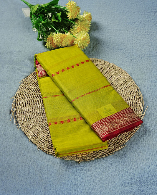 Lemon colour Narayanapattu cotton saree featuring a Rani pink colour stripped body, contrast rani pink colour with silver zari border and pallu, pairing a matching blouse piece.