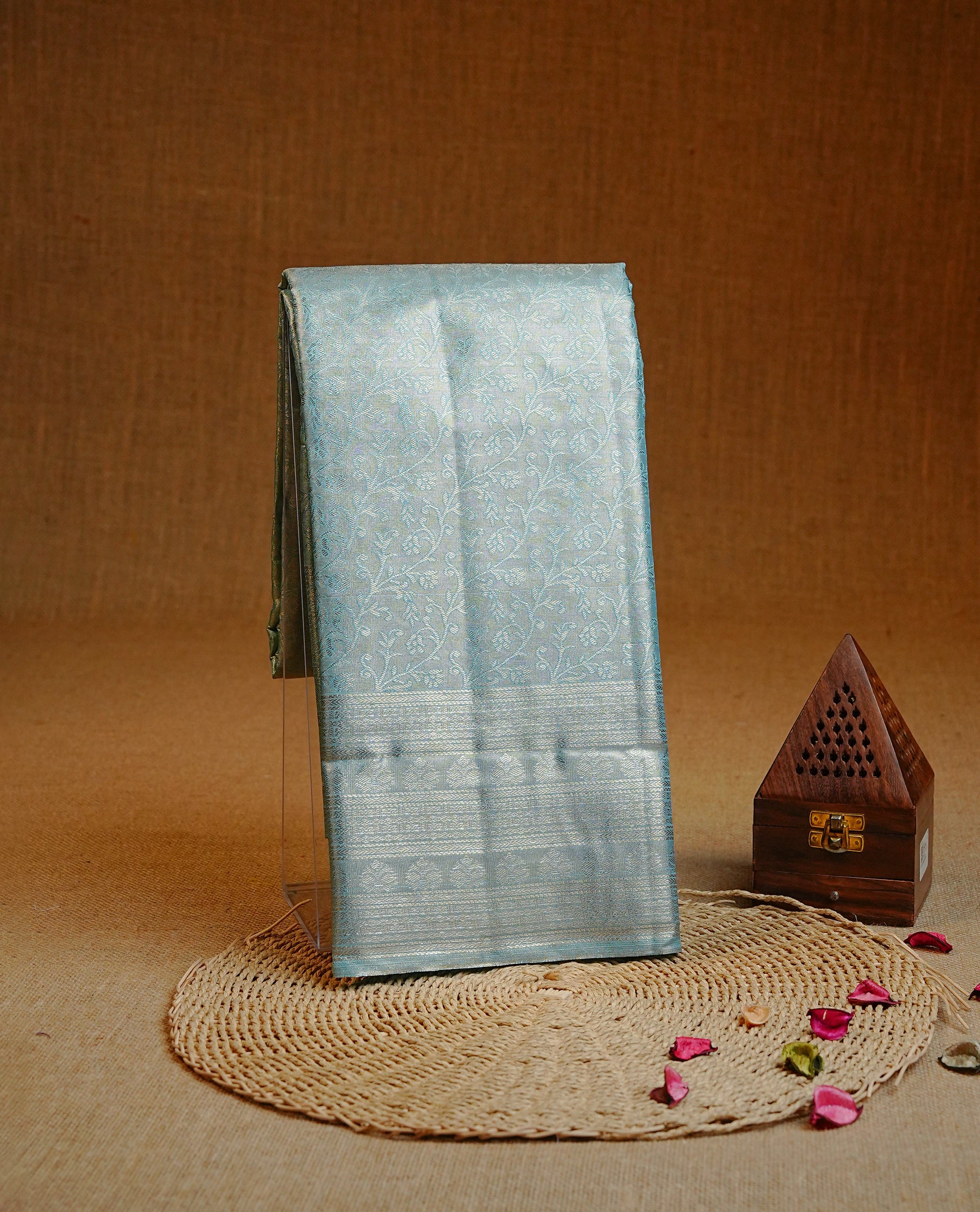 Ice Blue & Silver colour Double shade Semi tissue silk saree featuring silver zari kodi pattern on body, self colour with traditional border, paired with matching.