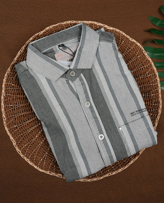Pastel green and off white self striped shirt crafted from soft Katrai cotton , Designed with roll up sleeves and a classic collar, this breathable piece blends traditional texture with a relaxed, modern silhouette.