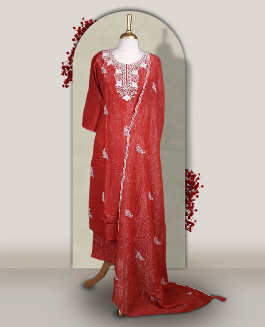 Orange colour churidar set featuring elegant white thread embroidery on the neckline, sleeves, and scattered motifs across the body, Paired with a matching embroidered dupatta, this ensemble radiates graceful charm and festive appeal.