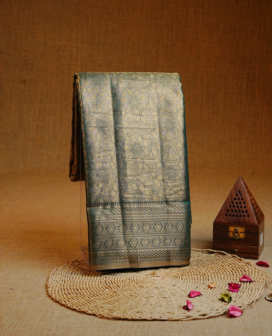 Green & Gold colour Double shade Semi tissue silk saree featuring self color kodi pattern on body, self colour with traditional border, paired with matching.