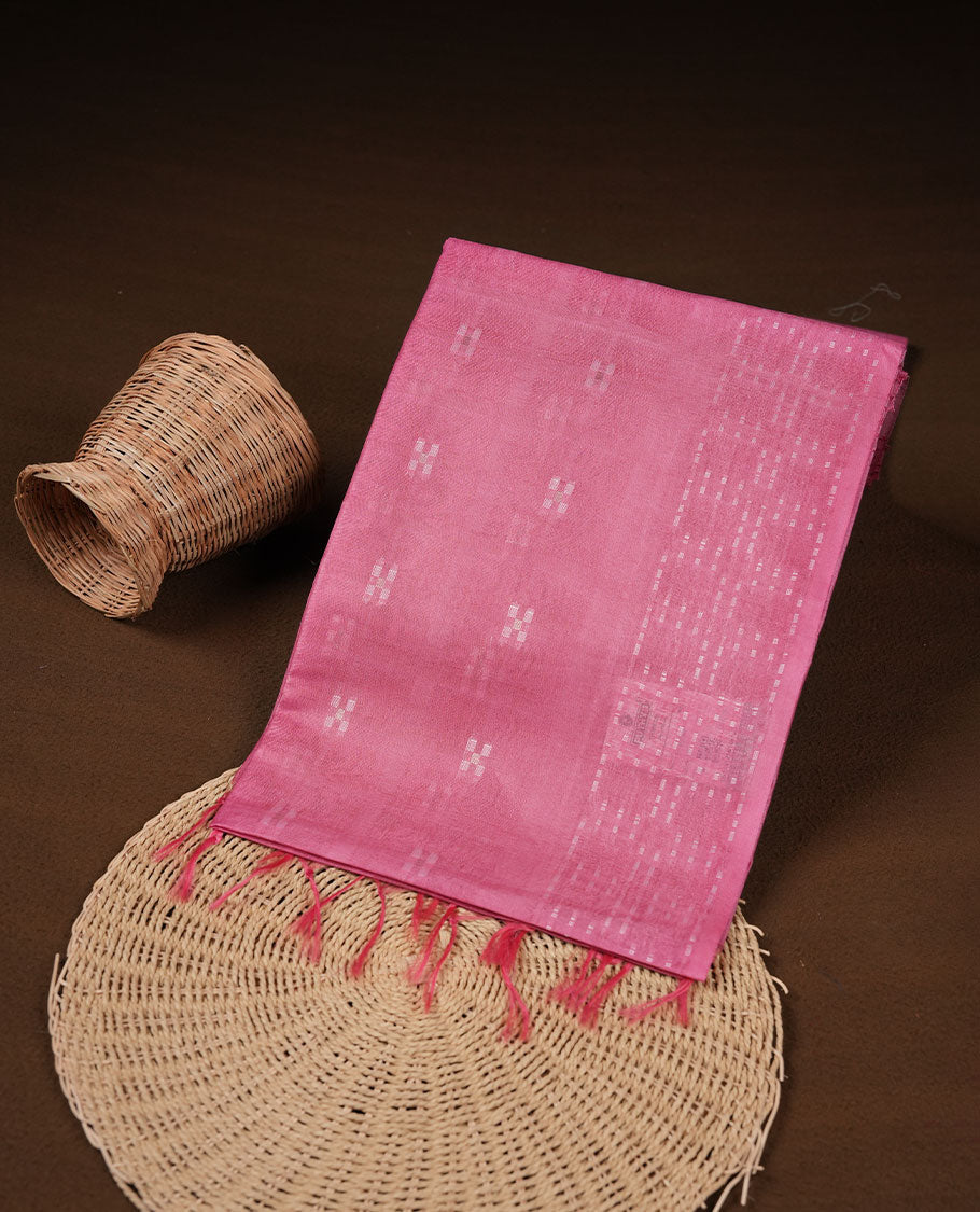 Pink colour semi jute saree highlighting white thread motifs on body, without border and paired with matching blouse.