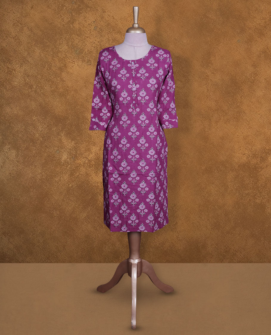 Purple colour kurti with white & black floral prints, knee length design, styled with a round neckline and a 3/4 sleeve .