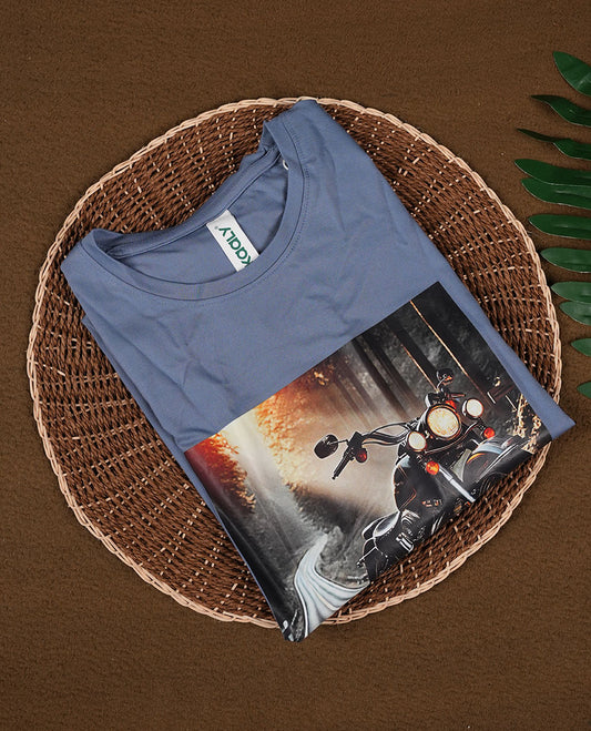 Greyish blue colour T shirt featuring a multicolour graphic print & designed with a classic round neck and short sleeves,made from soft breathable fabric for a comfortable and stylish everyday look.
