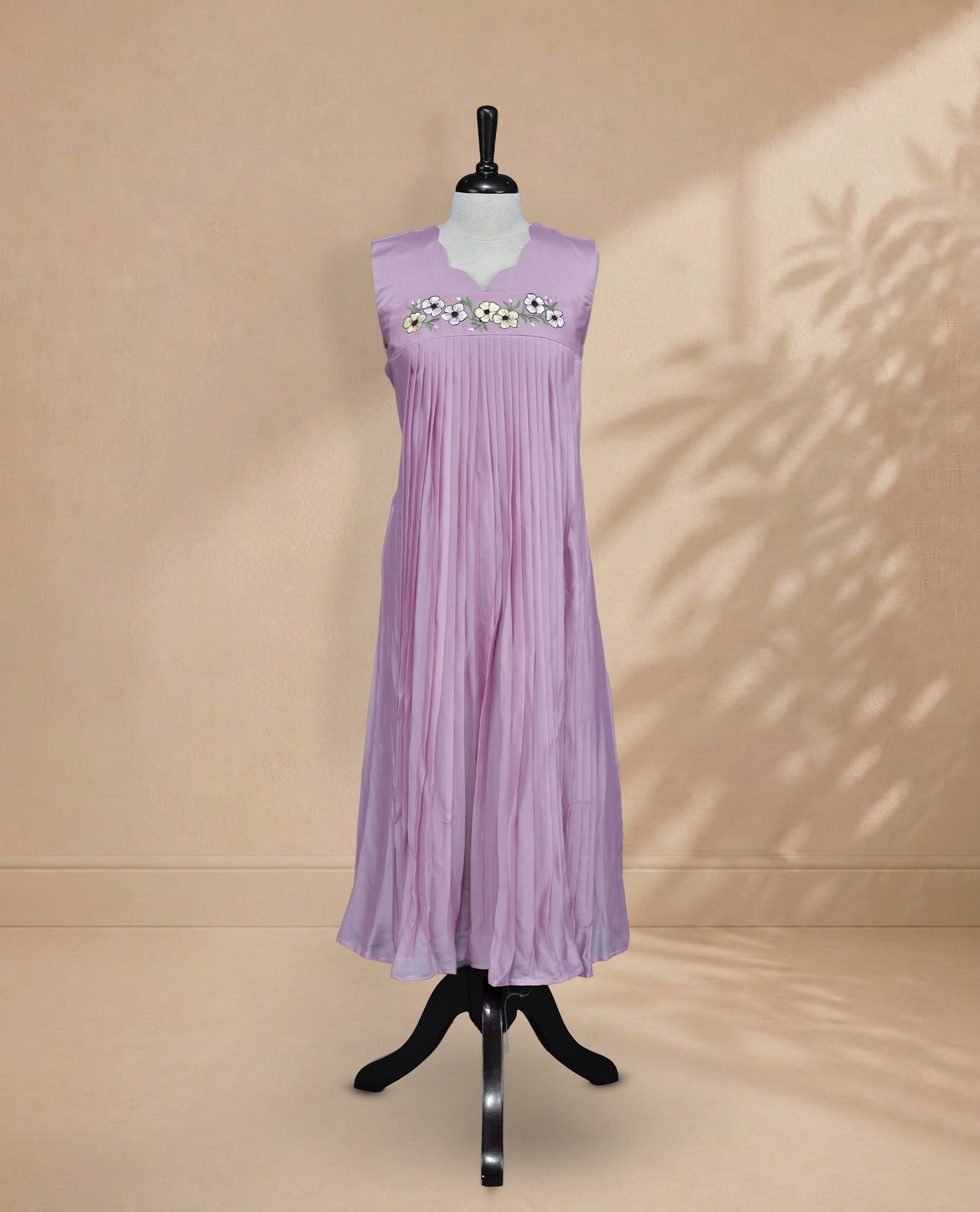 Lavender Coloured Sleeveless Kurti Featuring a Designed Neckline, Floral Embroidery on the Body